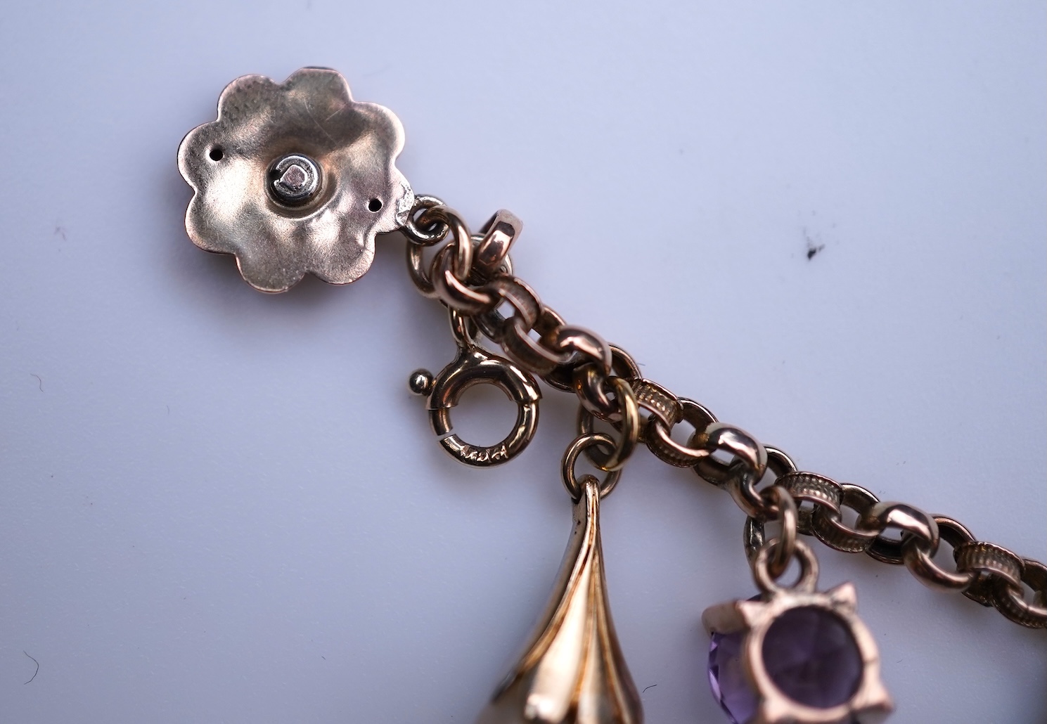 A gem-set charm bracelet, late 19th-early 20th century